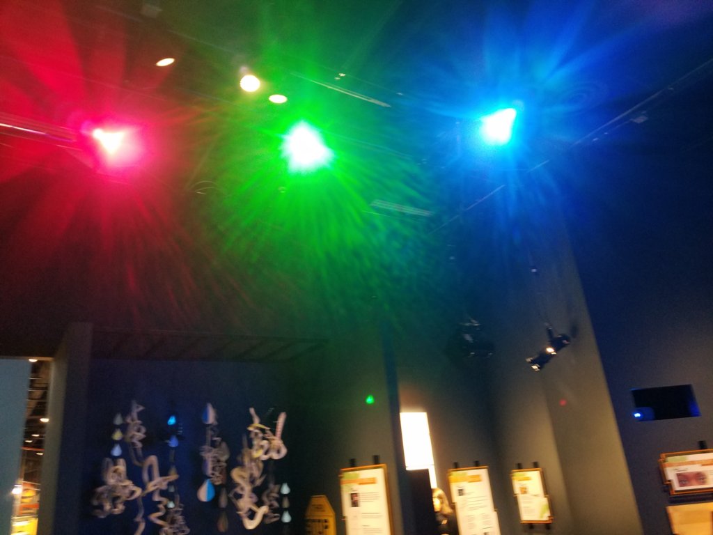 Photograph of the different primary lights that will, when combined, lead to a white wall.