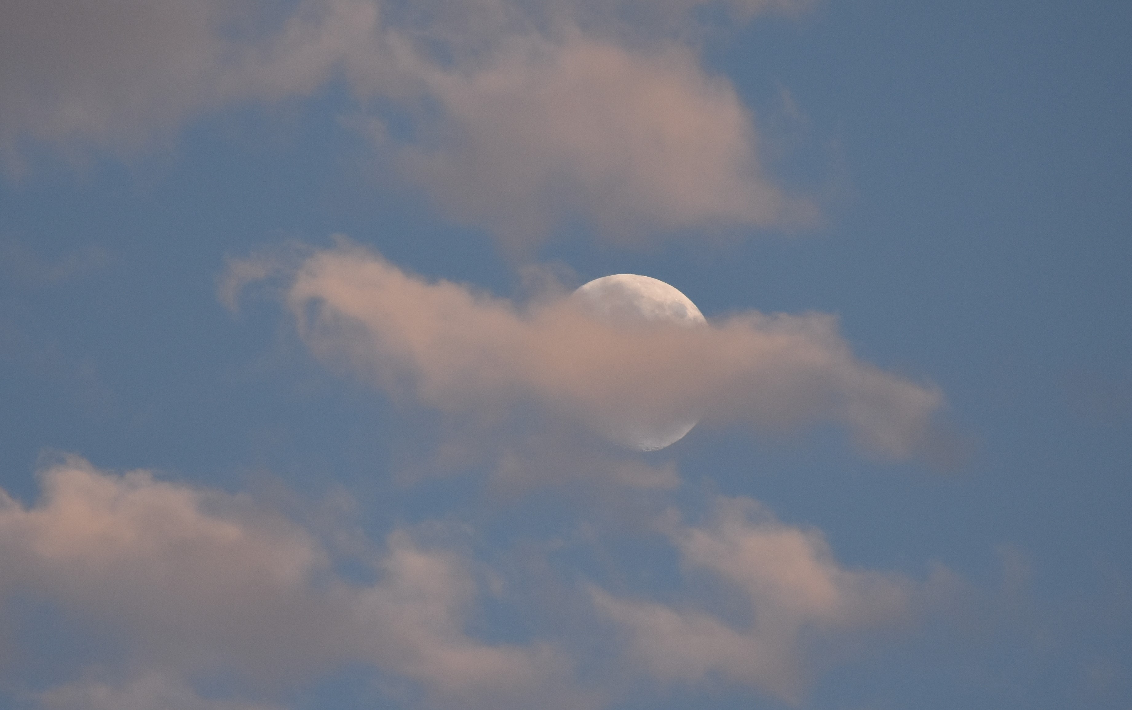 Clouds behind moon.